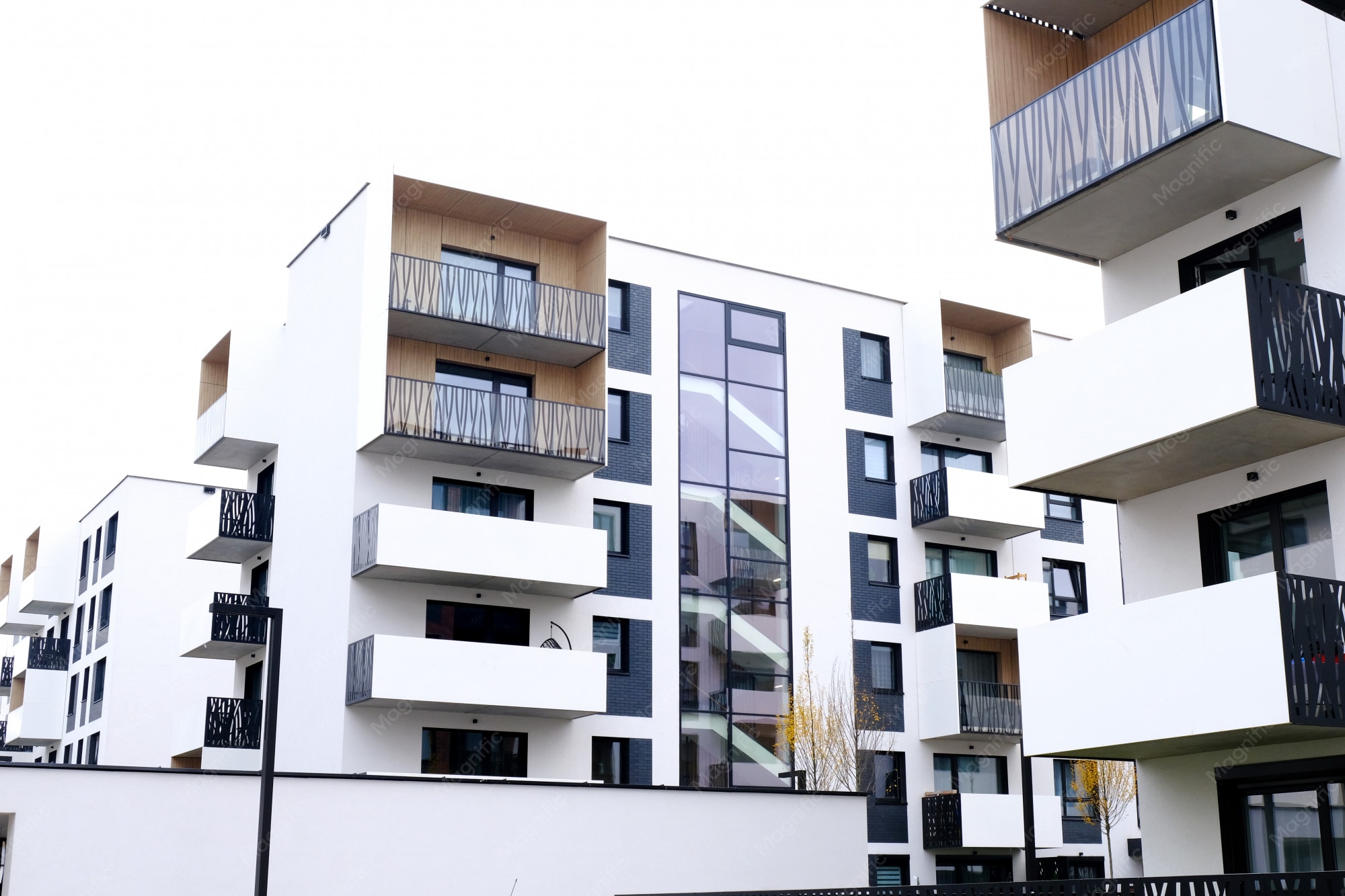 Modern high-rise apartment block with repeating balconies and windows